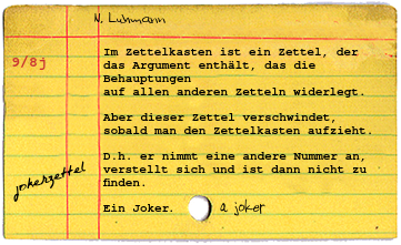 Yellowed library card catalog card with top red horizontal line and two vertical lines that split the card into three colums. Printed on the card are a red 9/8j on the left with the contents of Niklas Luhmann's jokerzettel card typed out. There are a few scribbles handwritten onto the card as well.
