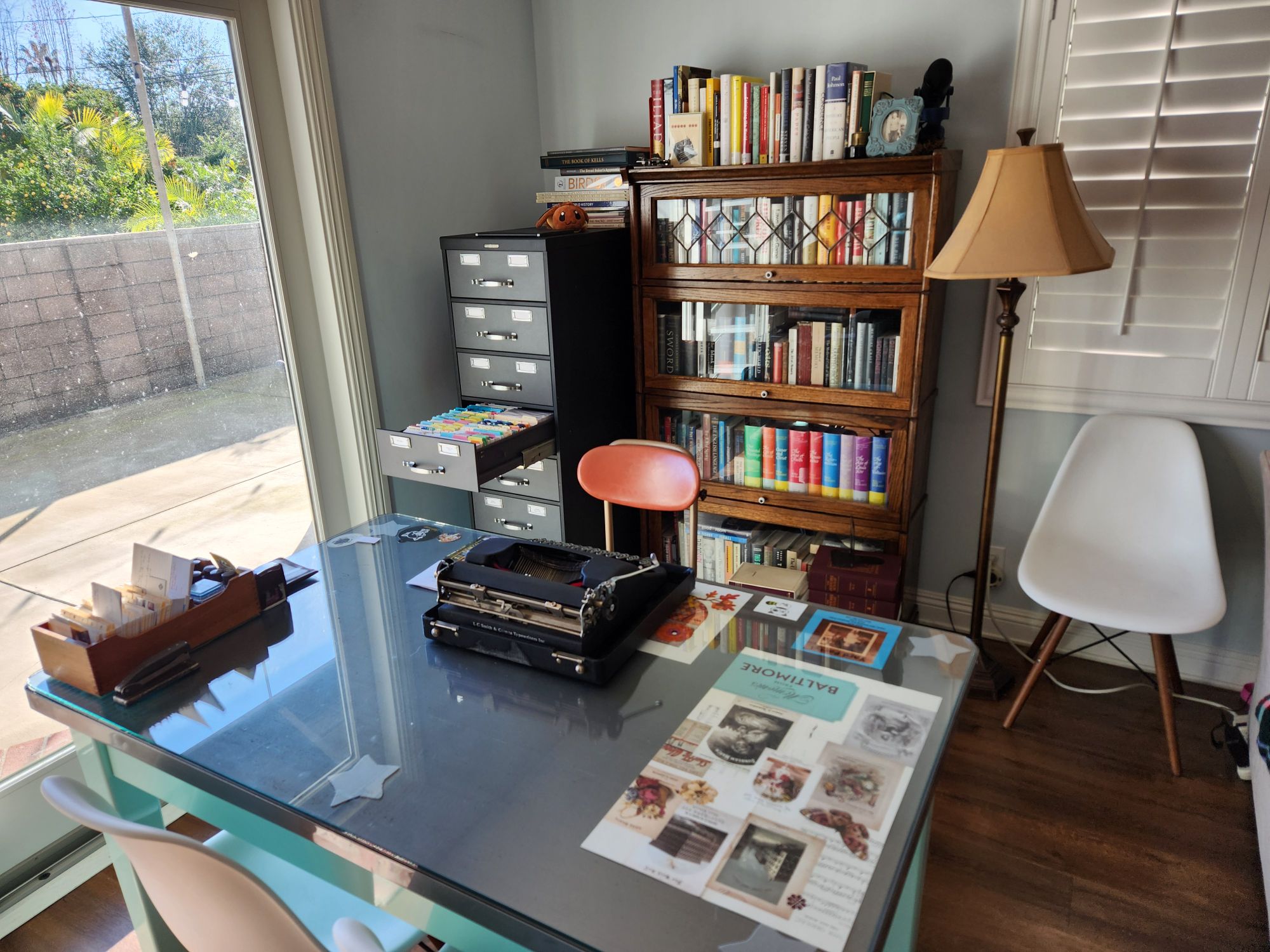 Photo of my office featuring a steel table, Steelcase card index, a Smith-Corona typewriter, and a barrister bookcase