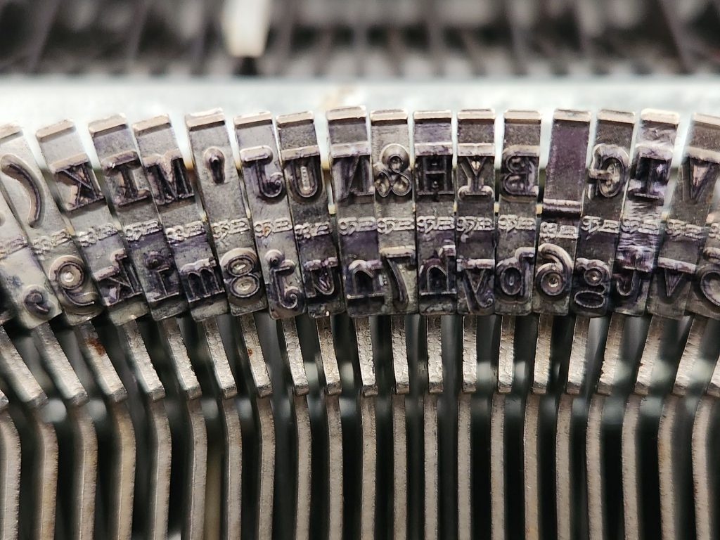 Close up of about 12 slugs on a Sears Newport faturing what looks like a 95 and the mushed together "AR" stamp of Albert Rodrian of RaRo fame.